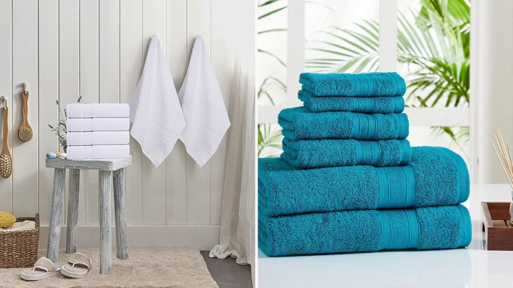 White bath towels hanging and folded on a stool; teal bath towels folded on a counter