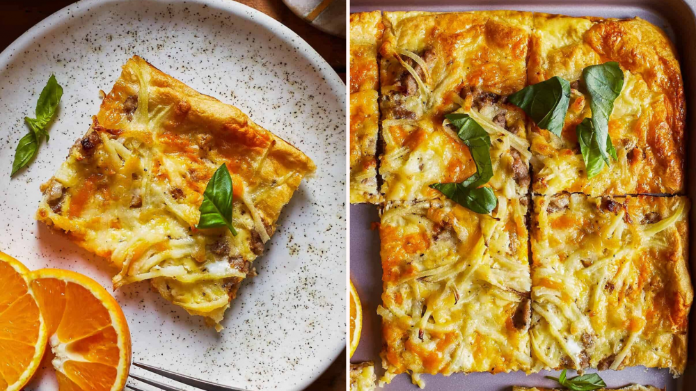 Closeup of breakfast pizza with sausage, hashbrowns, and basil