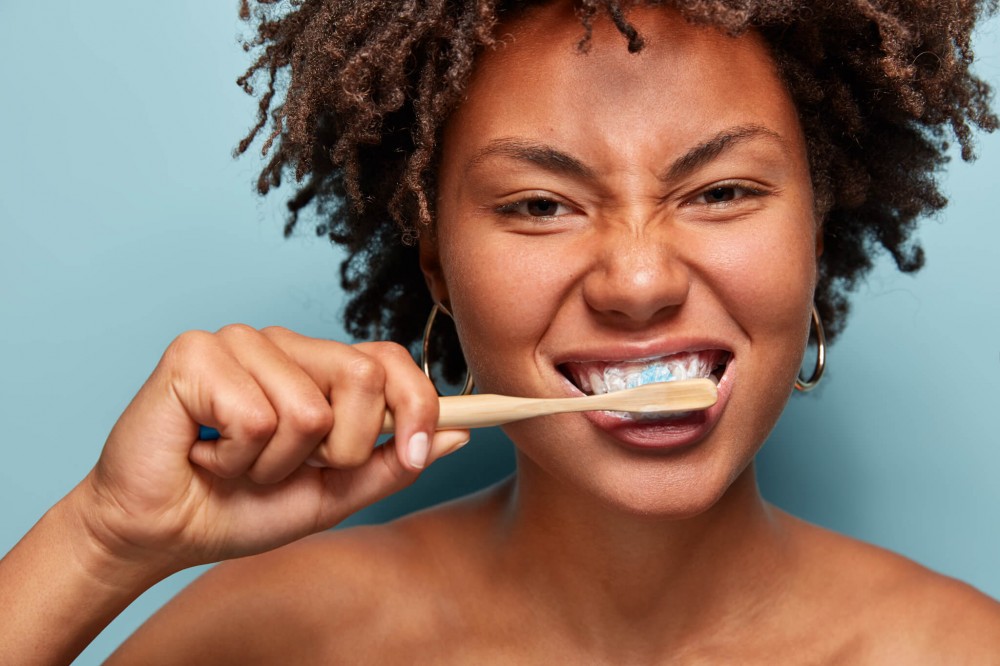 Woman brushing her teeth